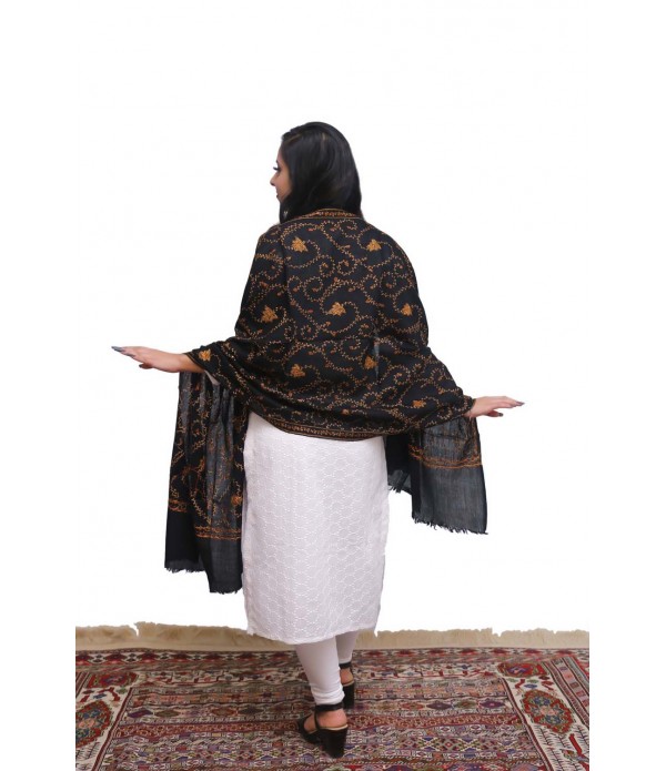 Black pashmina with orange thread embroidery.